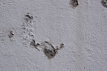 Close-up detail of cracked paint on wall. Background