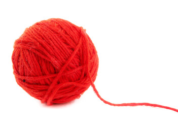Ball for knitting red threads on a white background 