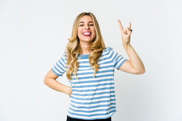Fototapeta na wymiar Young caucasian blonde woman showing rock gesture with fingers