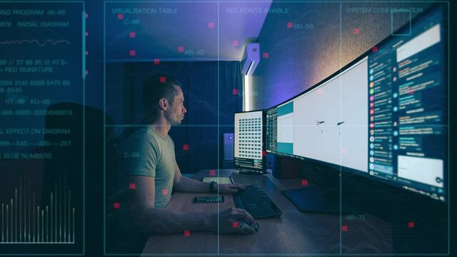 The engineer working on widescreen computer behind holographic layer