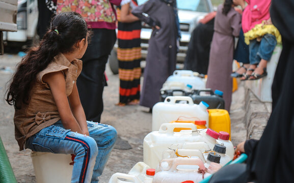Children fetch water due to the water crisis and the difficult living conditions of the residents of Taiz, Yemen