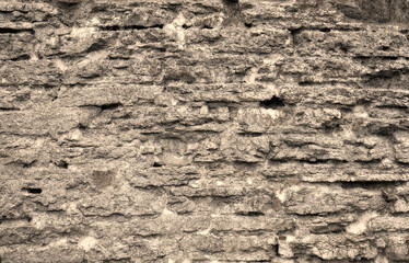 An old wall made of natural stone material
