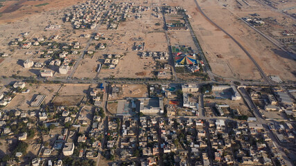 Obraz na płótnie Canvas Aerial view over Jericho City in palestine territory rooftops Drone view from dead sea city of Jericho, Jordan Valley, Israel/palestine 