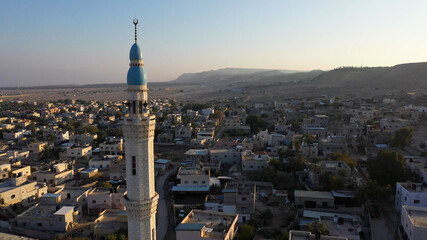 Mosque Tower minaret in Jericho city with Birds- aerial view
Drone view of Jericho city,sunset,...