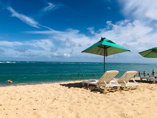 Fototapeta na wymiar beach with umbrellas and chairs