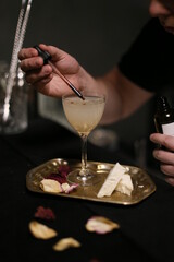 person with a glass of cocktail