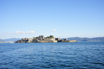Fototapeta na wymiar View of Gunkanjima or Battleship island, Ghost Island, from ferry boat in Nagasaki, Japan - 長崎 軍艦島