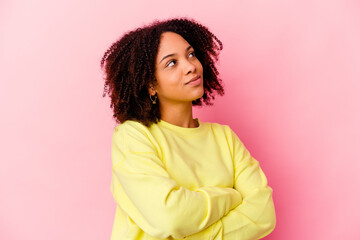 Fototapeta premium Young african american mixed race woman isolated dreaming of achieving goals and purposes
