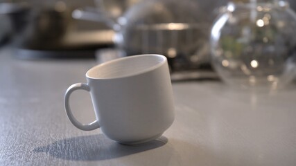 Coffee Cup Spinning Around and Standing on Kitchen Table
