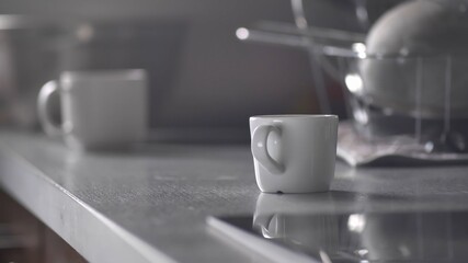 Coffee Cup Spinning Around and Standing on Kitchen Table