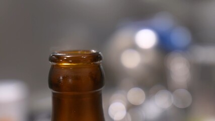 Opening Beer Bottle with Bottle Opener Close Up