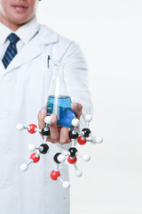 A chemist holding a flask