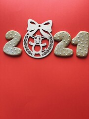 Ox year 2021 wooden toy on red background 