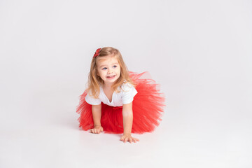 toddler girl in red skirt and white t-shirt on white background. Valentine Day concept.