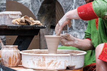hands of a potter at work