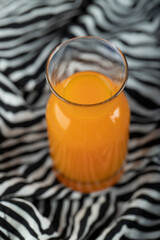 A glass pitcher with delicious orange juice
