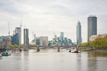 View upstream from Westminster Bridge to Lambeth Bridge with St Georges Wharf Tower, or Vauxhall Tower, residential skyscraper. London, UK.