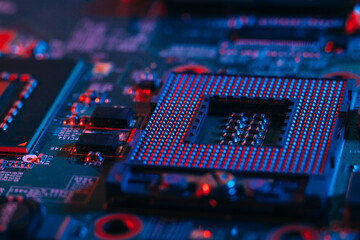 Processor socket in neon light. Motherboard with microchips. Dark photo.CPU processor.PC components.. - obrazy, fototapety, plakaty