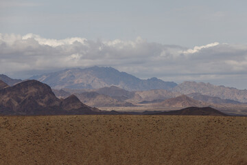 the Ethiopian desert where the earth is brown and the sky is dramatically dark moaning in contrast