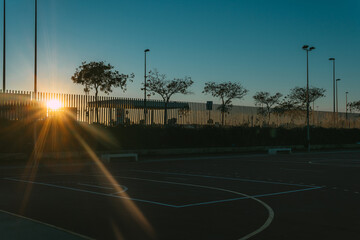 Sunset on a street football court. Soccer.