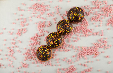 Colorful set of sweet chocolate small doughnuts