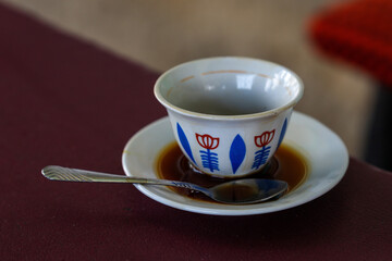 on the table a cup of coffee in traditional Ethiopian style
