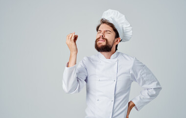 Emotional chef in a headdress gestures Copy Space hands