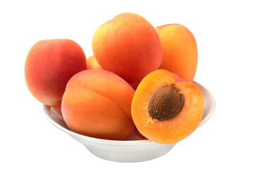 Several whole and one sliced fresh juicy apricots on a plate isolated on white background.