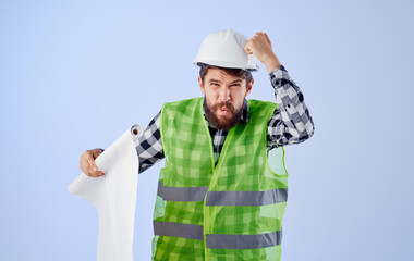 Man in working form blueprints professional security project