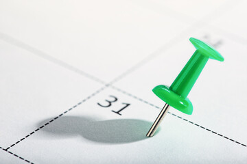 Important date and calendar appointment.Red pin on calendar.