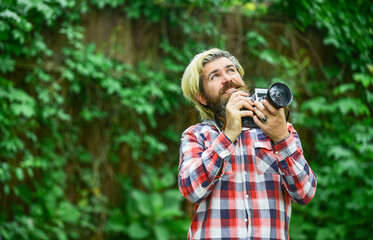Fototapeta na wymiar What a great day. reporter make photo. vintage camera. capture these memories. SLR camera. hipster man with beard use professional camera. photographer hold retro camera. journalist is my career