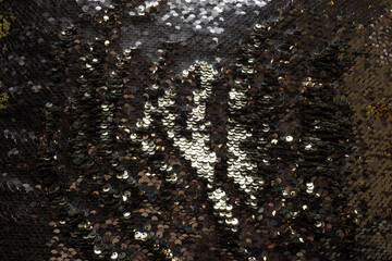 Background made of a pillow of gold sequins bronze white and brown colors