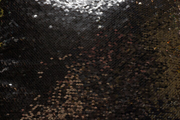 Background made of a pillow of gold sequins bronze white and brown colors