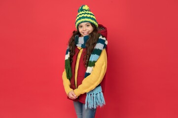 kid with happy face wearing warm winter clothing and get ready for holidays, winter holidays