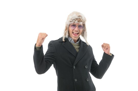 keep yourself warm. happy unshaven man in coat and earflap hat. confident and handsome guy feel comfortable. charismatic male looking stylish in winter isolated on white. fashion