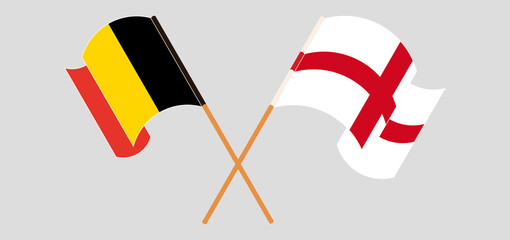 Crossed and waving flags of Belgium and England