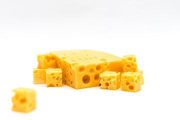 Close up of appetizing cheese cubes with holes
