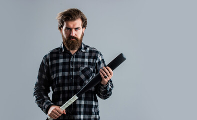 brutal man with baseball bat express aggression or play game, equipment