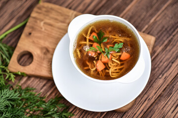 Slow-boiled broth based on several types of meat and aromatic vegetables. - obrazy, fototapety, plakaty