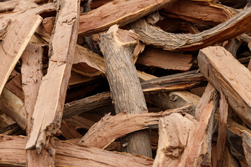 many pieces of wood stacked in a pile to form an interesting pattern