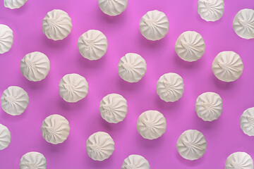 white sweet fluffy marshmallows pattern on pink background.wallpaper.top view.close up.copy space.candy.colorful dessert.