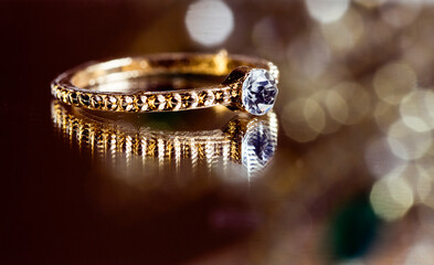 Close up of elegant diamond ring. Love and wedding concept. 