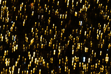 Naklejka premium Christmas ilumination bokeh gights in the city