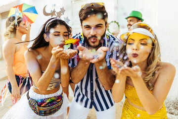 Obraz na płótnie Canvas Brazilian Carnival. Group of Brazilian people celebrating the carnival party in the city