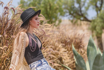 Trendy and beautiful young girl outdoors in summer with boho style © Elmer Hidalgo Photo
