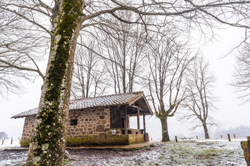 Refuge of mount aizkorri in gipuzkoa. Snowy landscape by winter snows. Basque Country, Spain