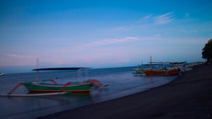 Obraz premium Boats at Sunrise. wooden boats, Traditional Boats Bali