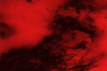 Red and black mix as a background of clouds and fog. Black and red wallpaper, decoration or design.