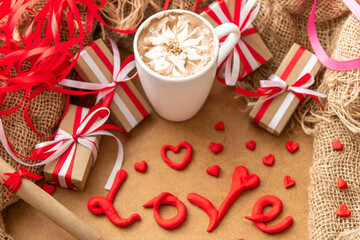 Delicious festive cappuccino with gifts on Valentine's day.