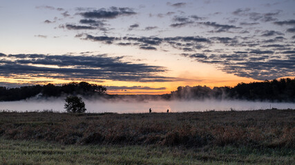 morning fishermen in the fog